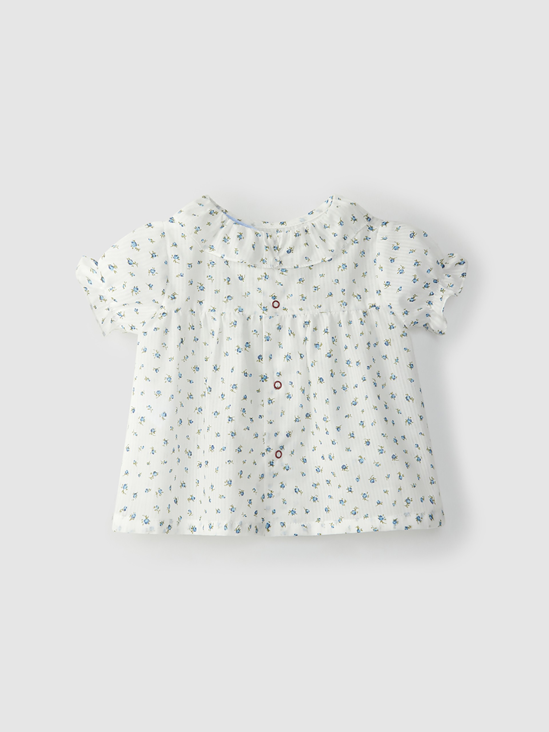 Blusa de algodón con flores y cuello de volantes