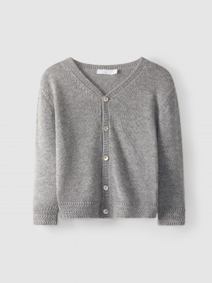 Gilet tricoté à col en V avec fantaisie Gilet tricoté à col en V avec fantaisie