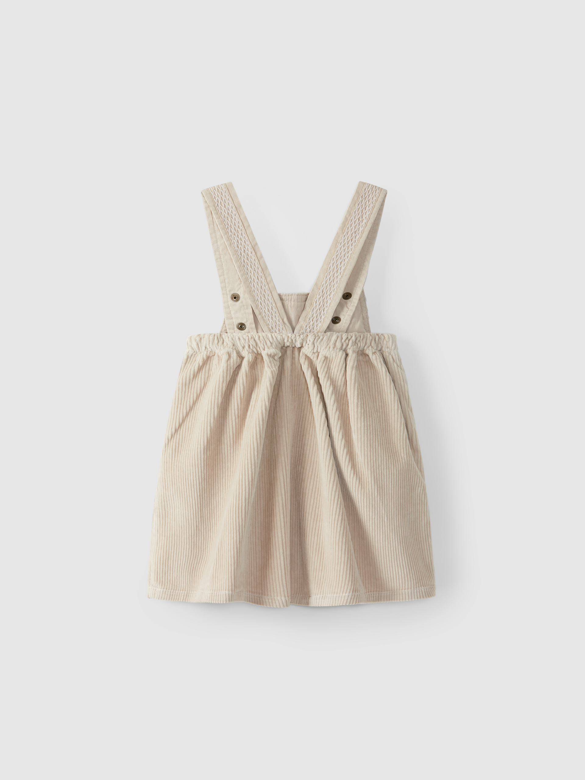 High-waisted, under-bust skirt with suspenders, with pockets