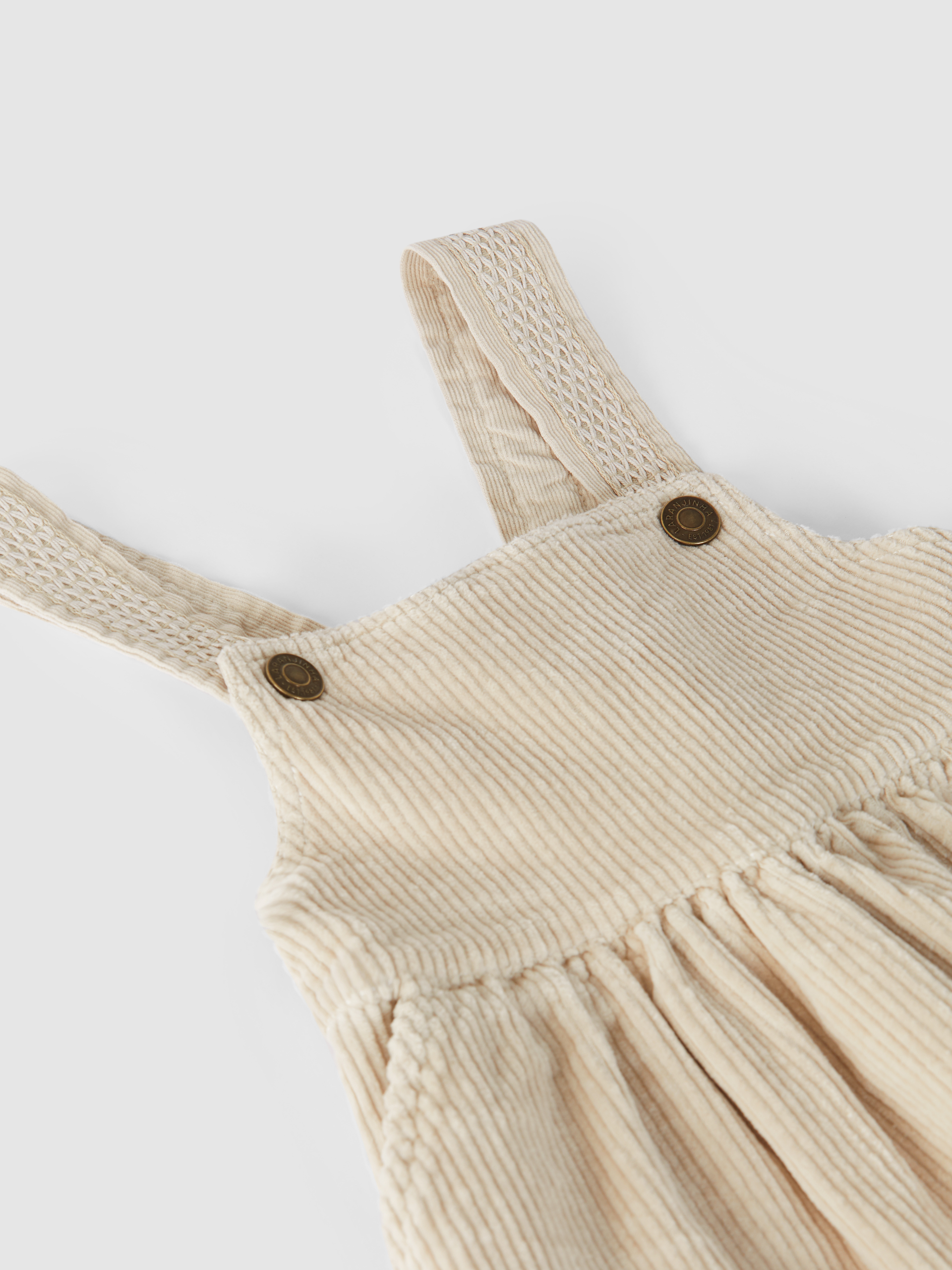 High-waisted, under-bust skirt with suspenders, with pockets