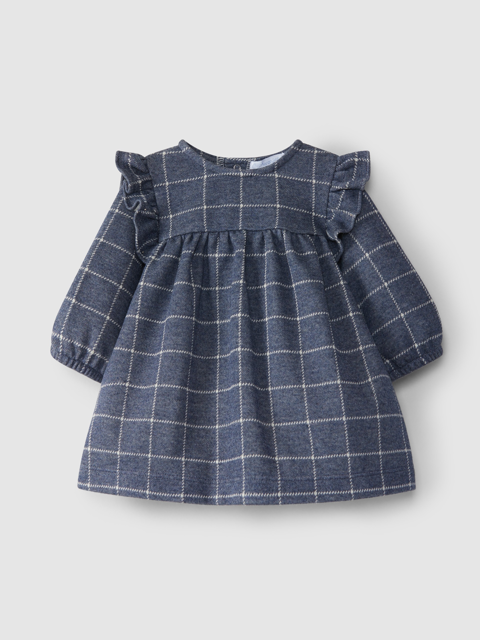 Robe en maille à carreaux et détail de volant