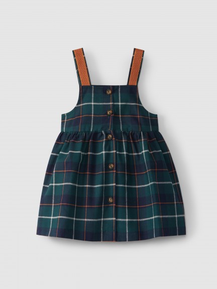 Plaid high-waisted skirt with suspenders. Plaid high-waisted skirt with suspenders.