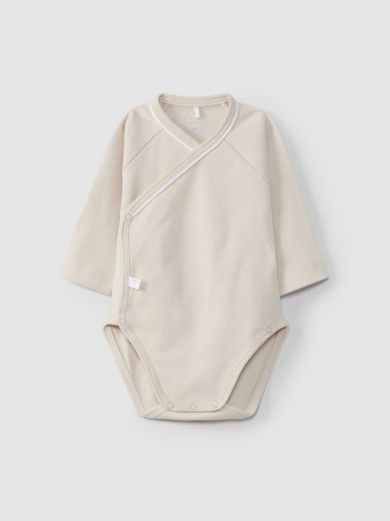 Crossover bodysuit with decorative detail Crossover bodysuit with decorative detail