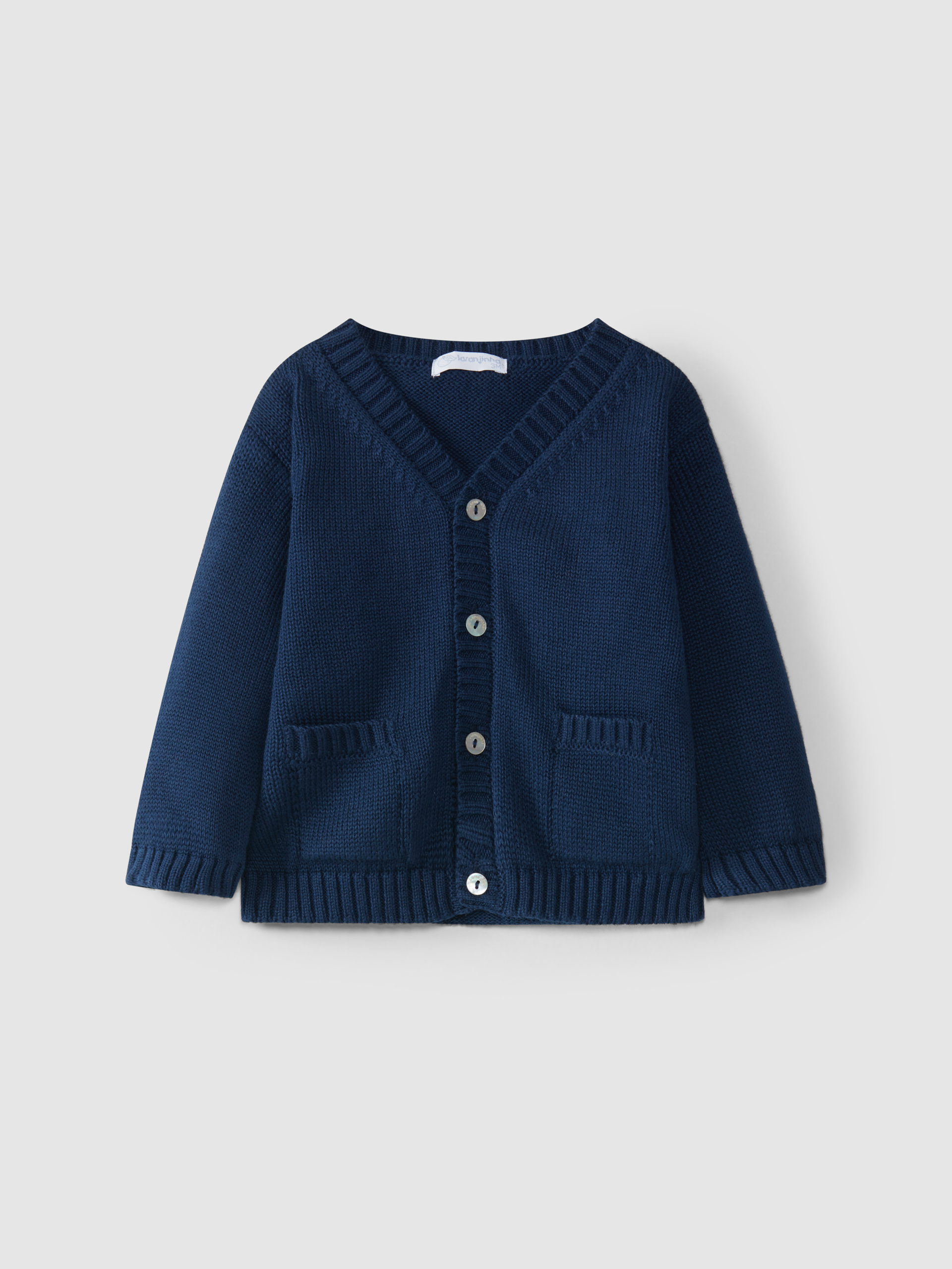 Gilet tricoté à col en V avec poches
