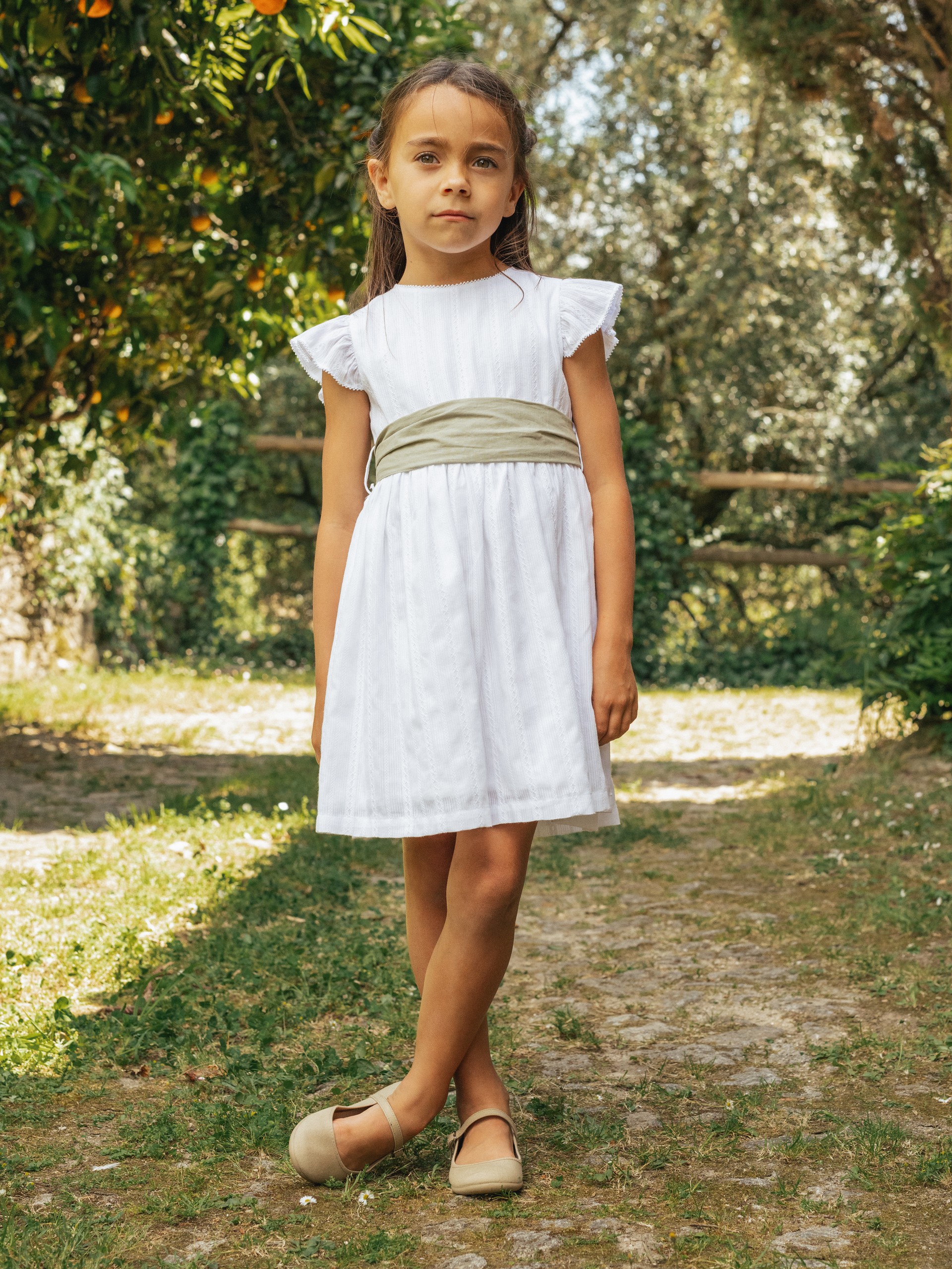 Embroidered fabric dress with sash