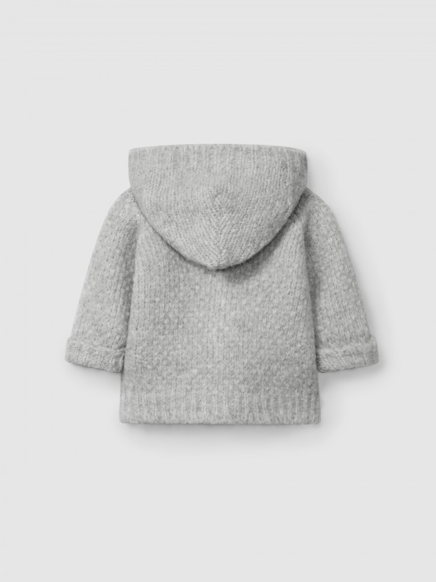 Gilet tricoté à capuche Gilet tricoté à capuche
