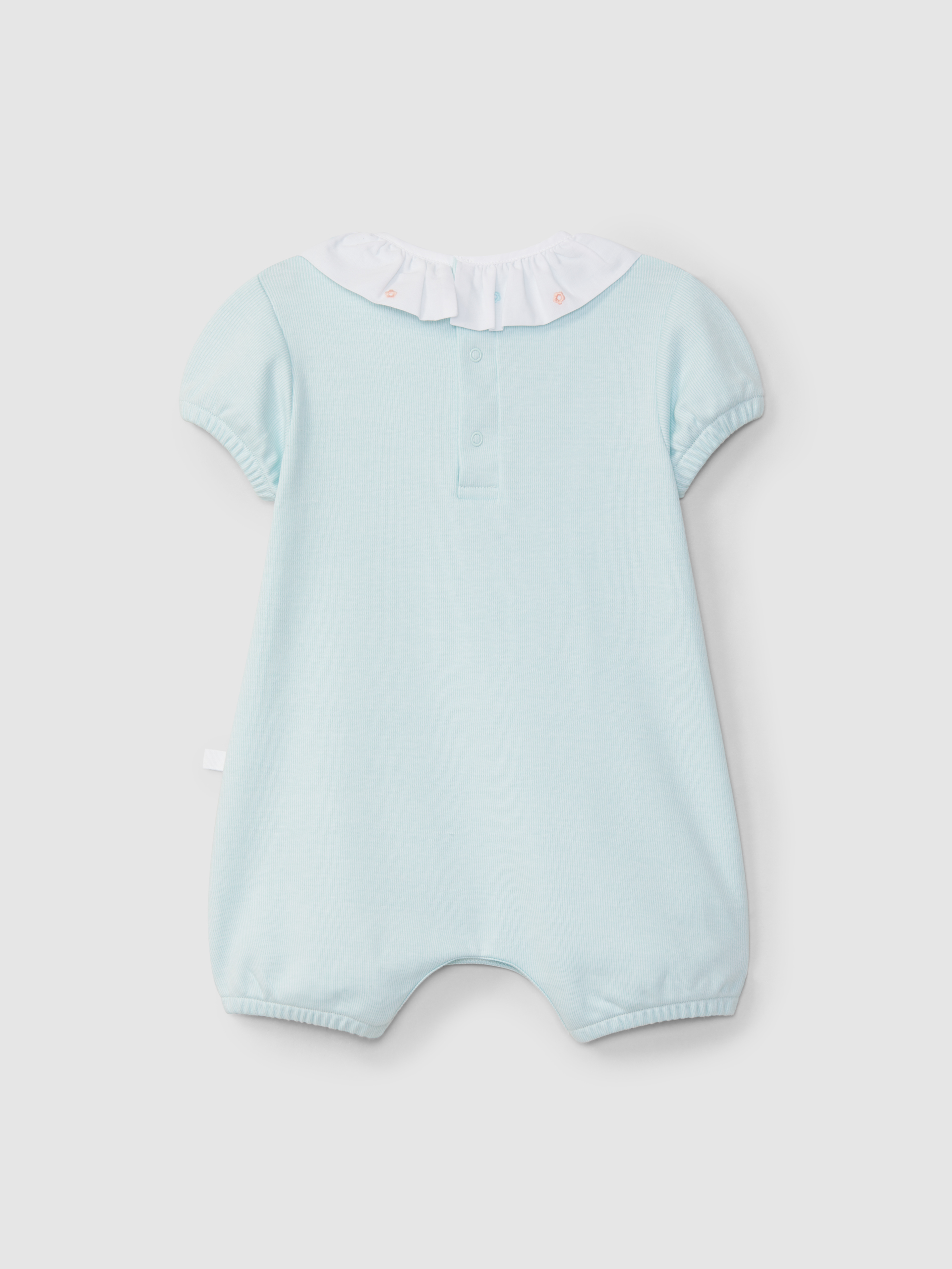 Trajecito cuello volante con flores bordadas