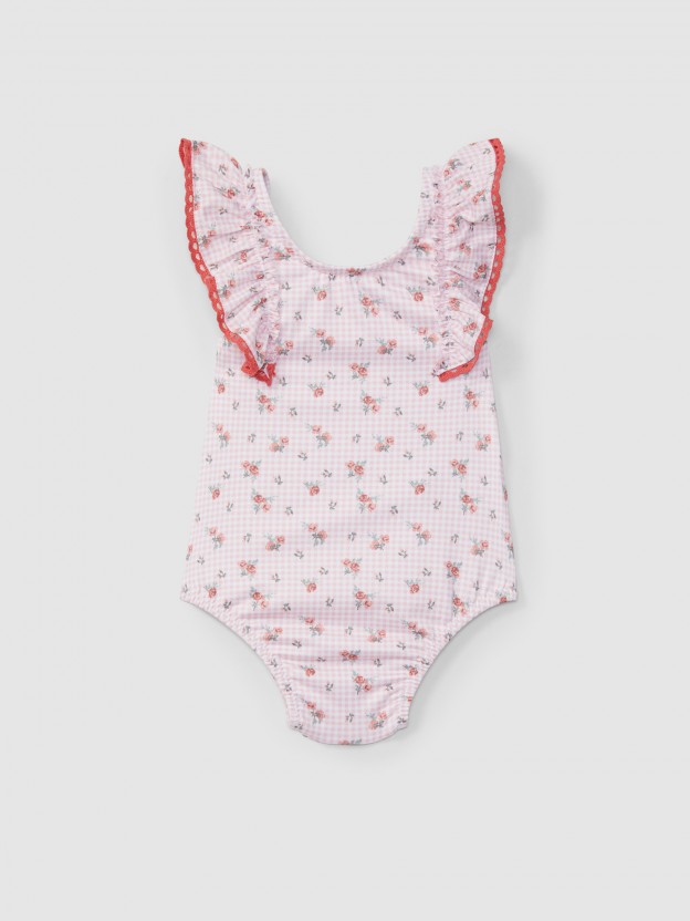 Shortie-style swimsuit flowers and crochet detail Shortie-style swimsuit flowers and crochet detail