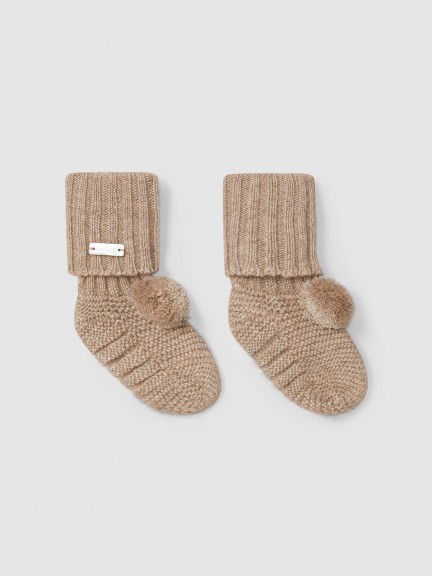 Knitted booties with pom-pom Knitted booties with pom-pom