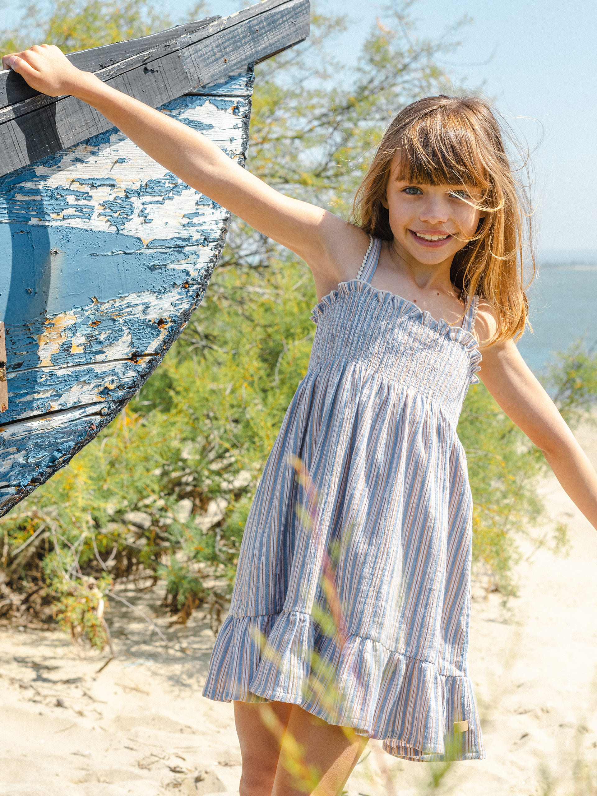 Dress with multi-coloured striped straps