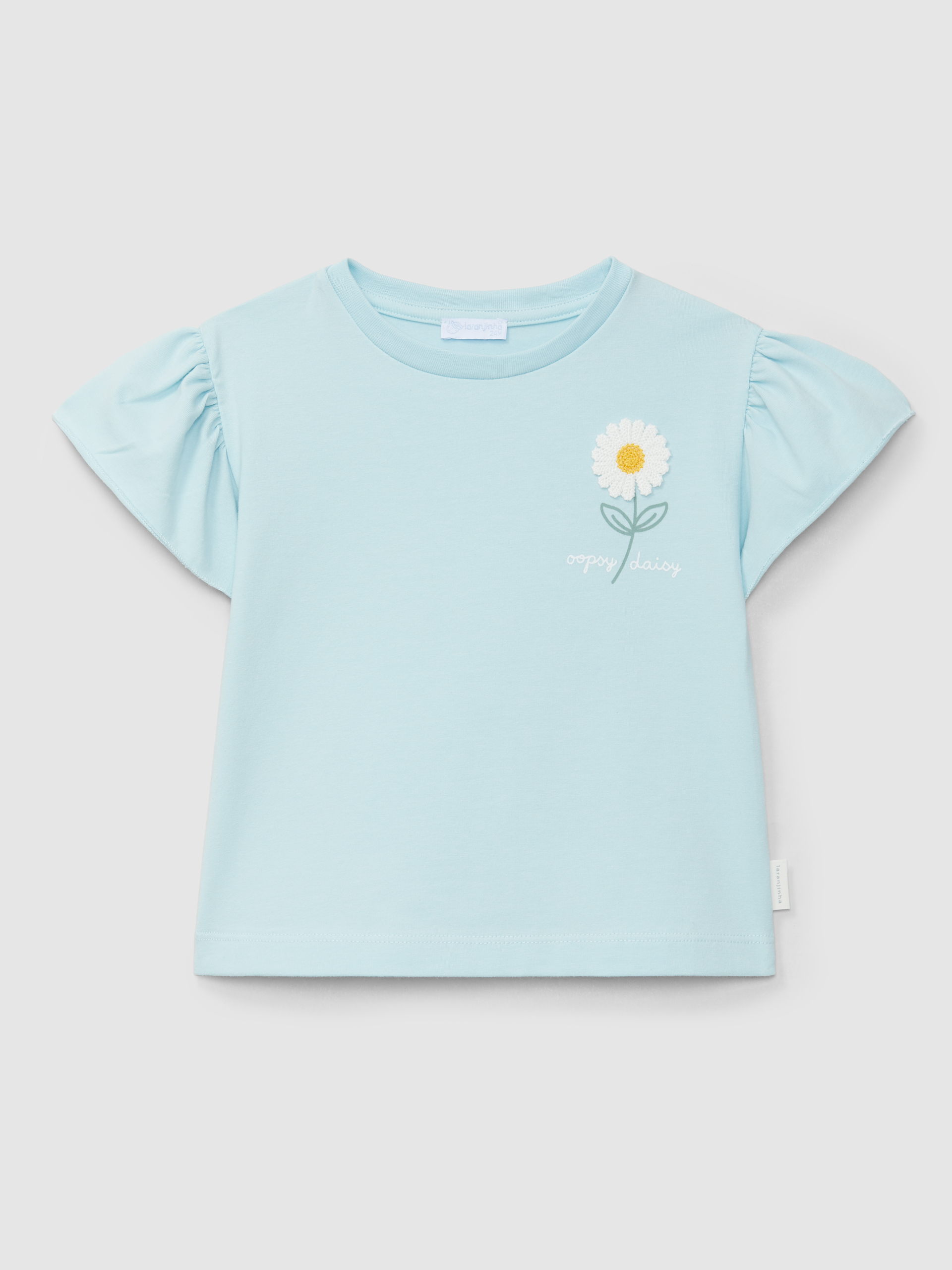 Camiseta con aplicaci+on de flor en relieve