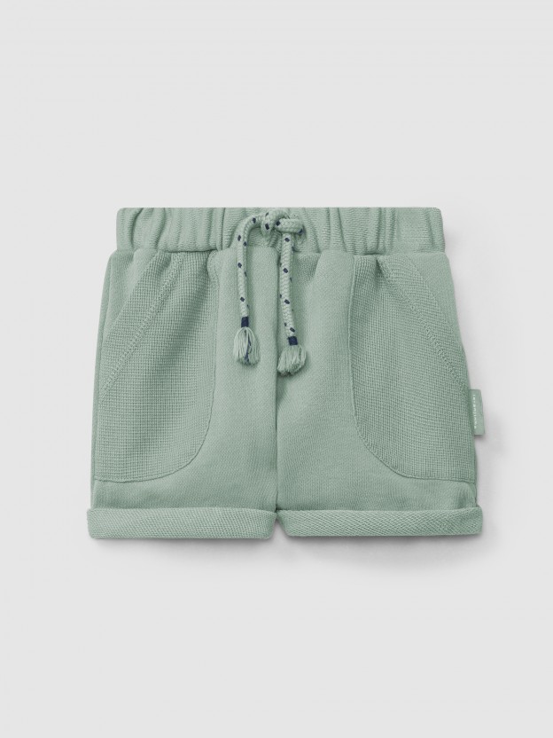 Calções pull-up em felpa com bolsos malha waffle Calções pull-up em felpa com bolsos malha waffle