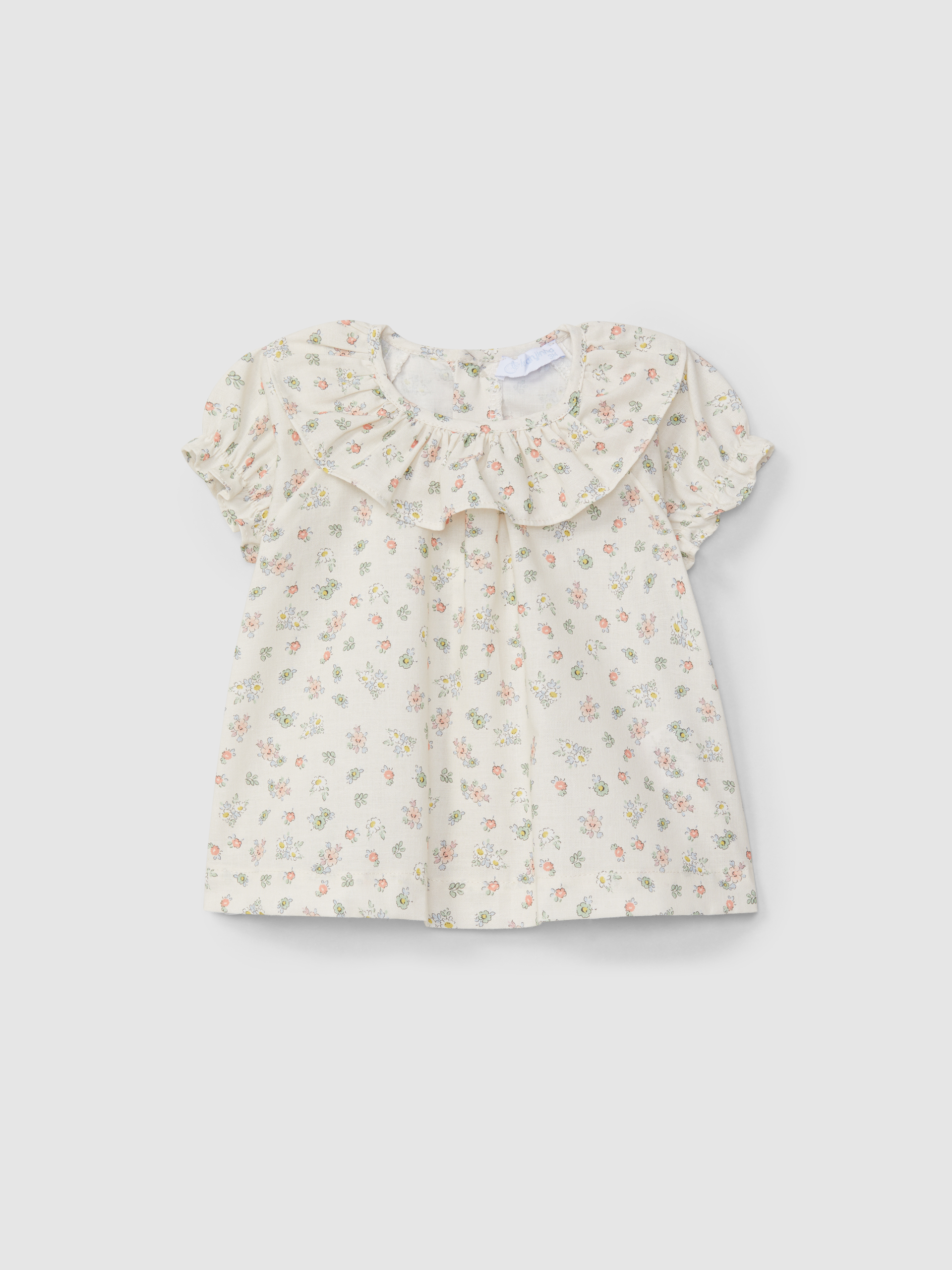 Blusa estampado floral con cuello de voltante