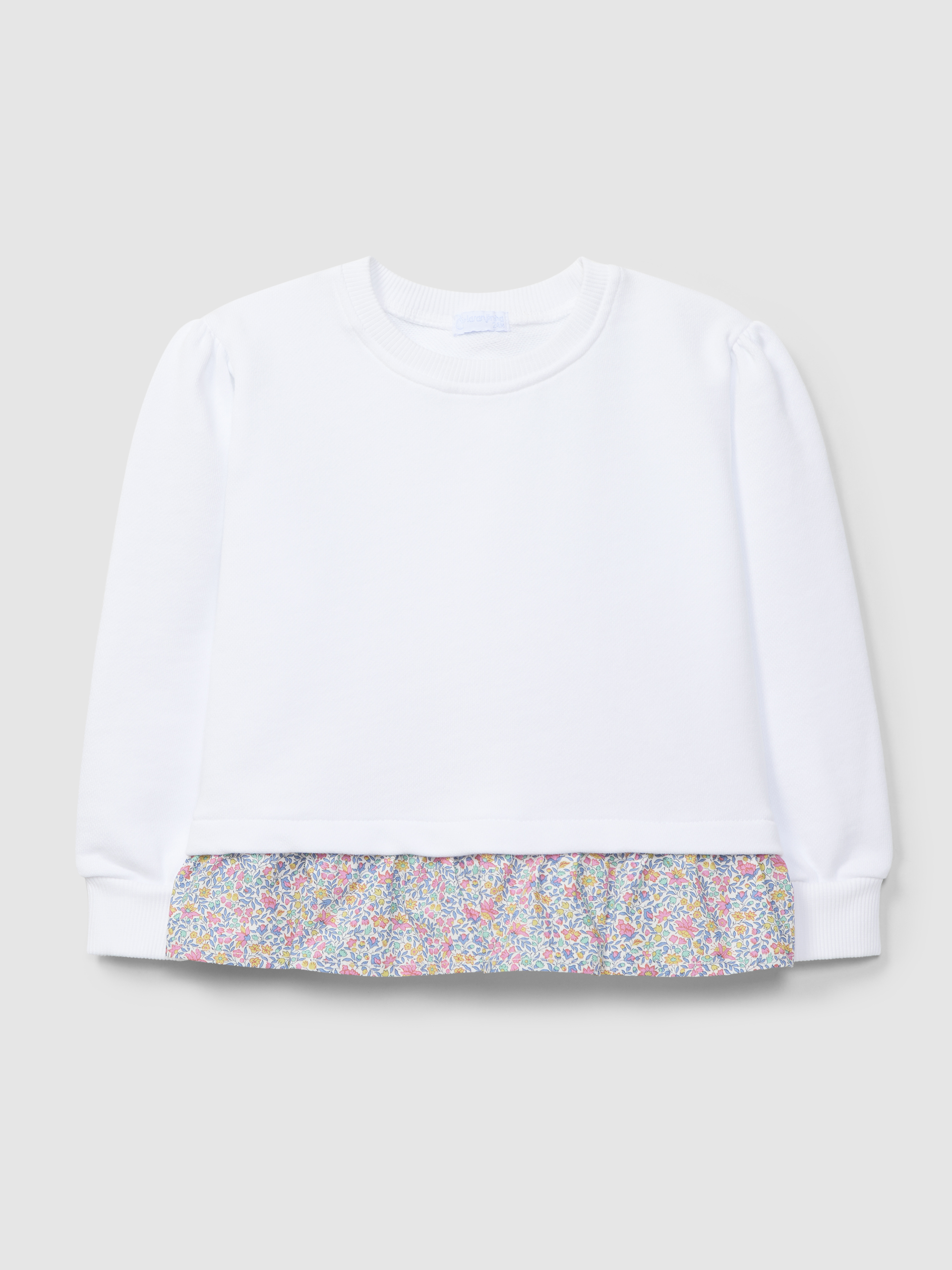Plush sweater with ruffled detail in printed fabric