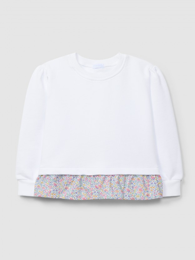Plush sweater with ruffled detail in printed fabric