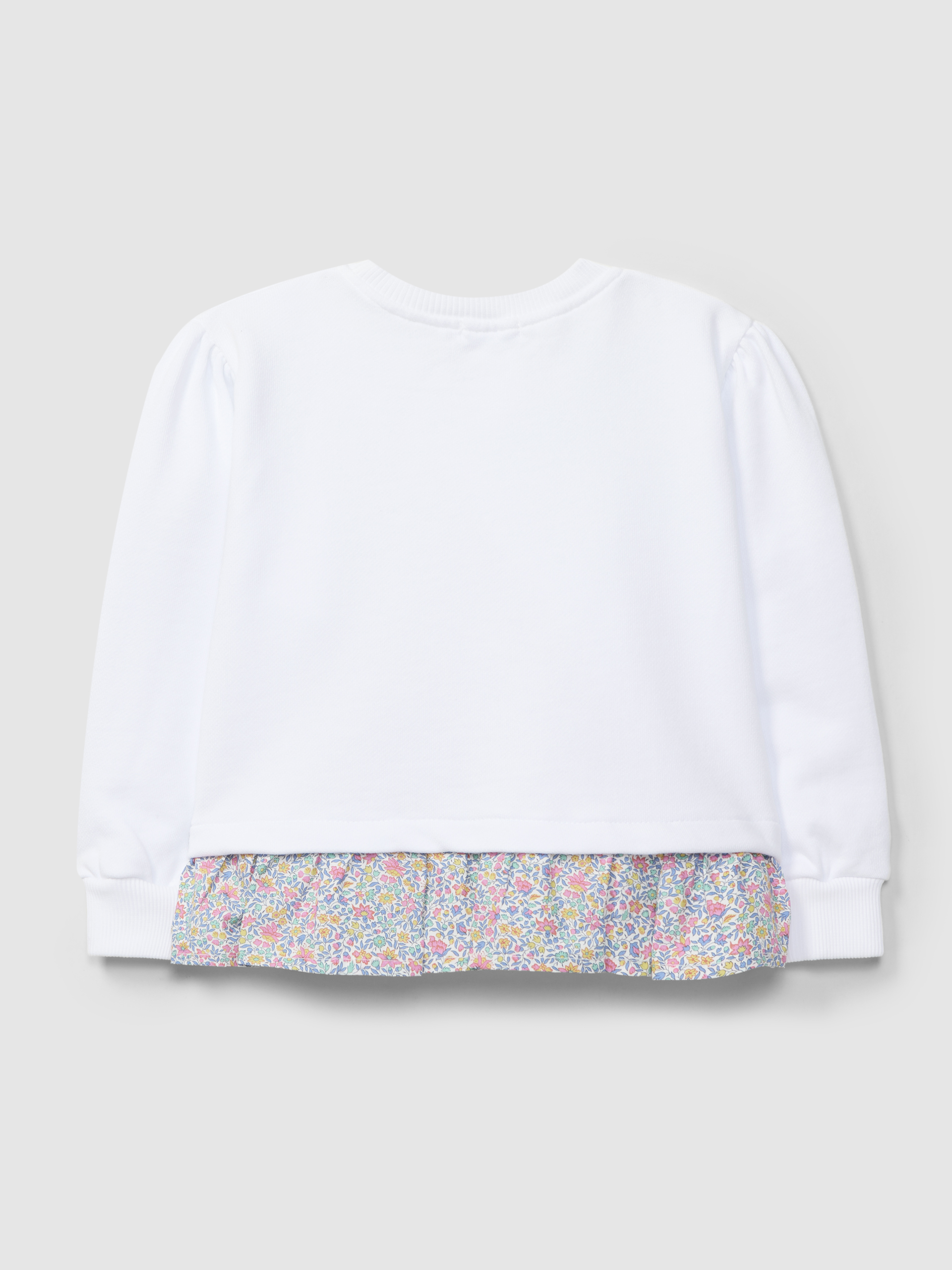 Plush sweater with ruffled detail in printed fabric