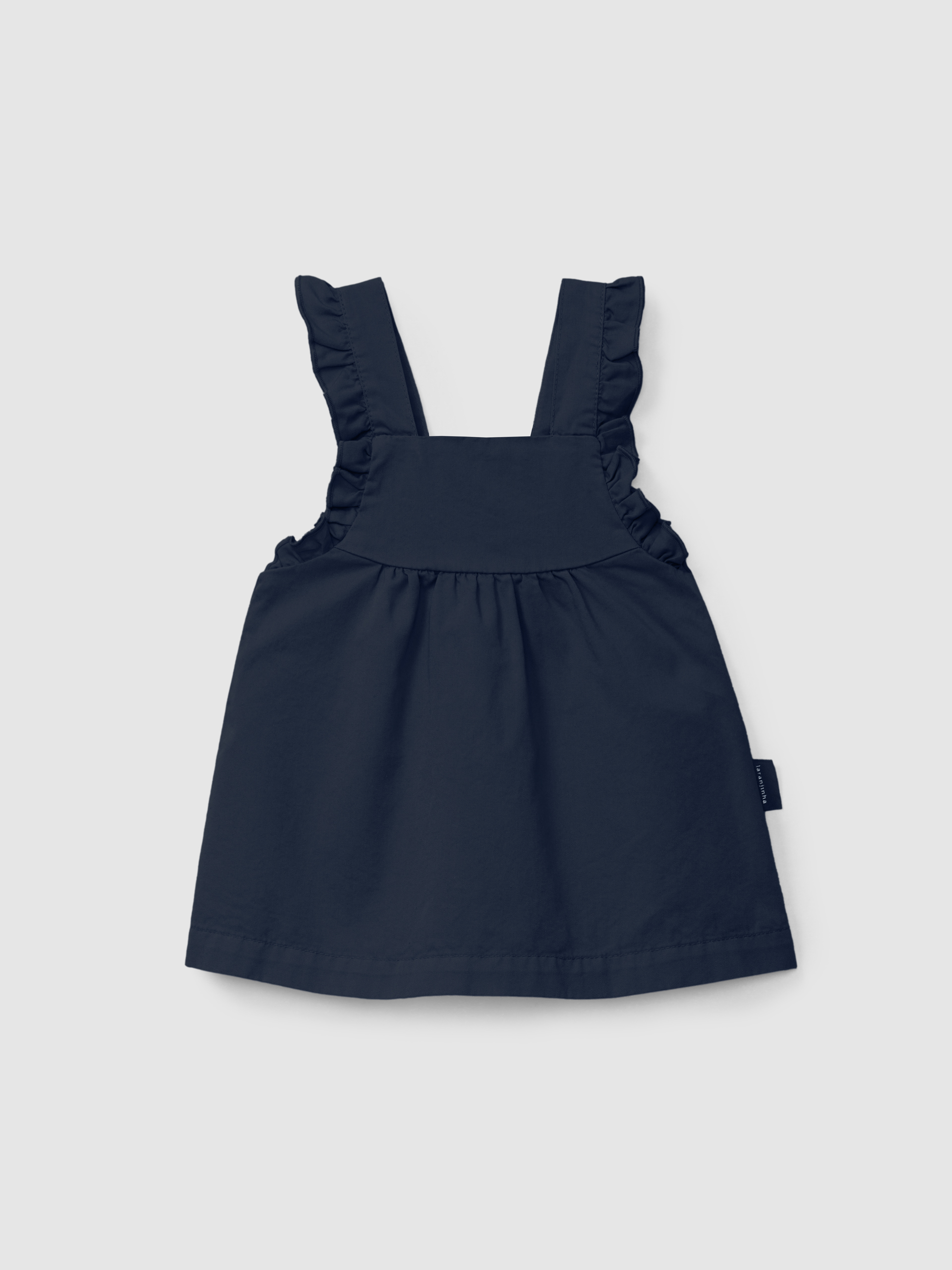 Dungaree skirt in twill with ruffled detail on the straps