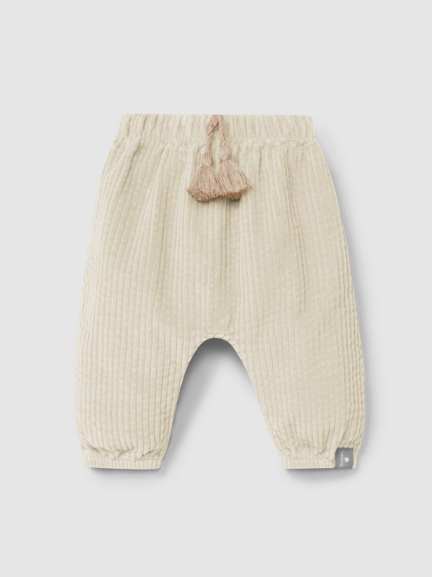 Pull-up pants in ribbed velvet and drawstring detail with pom-pom Pull-up pants in ribbed velvet and drawstring detail with pom-pom