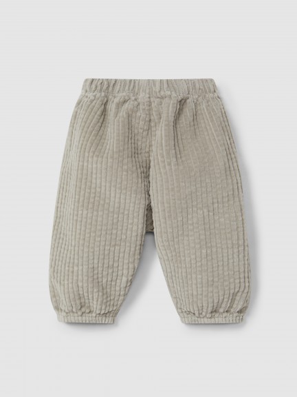 Calças pull-up em veludo canelado e detalhe de cordão com pom-pom Calças pull-up em veludo canelado e detalhe de cordão com pom-pom