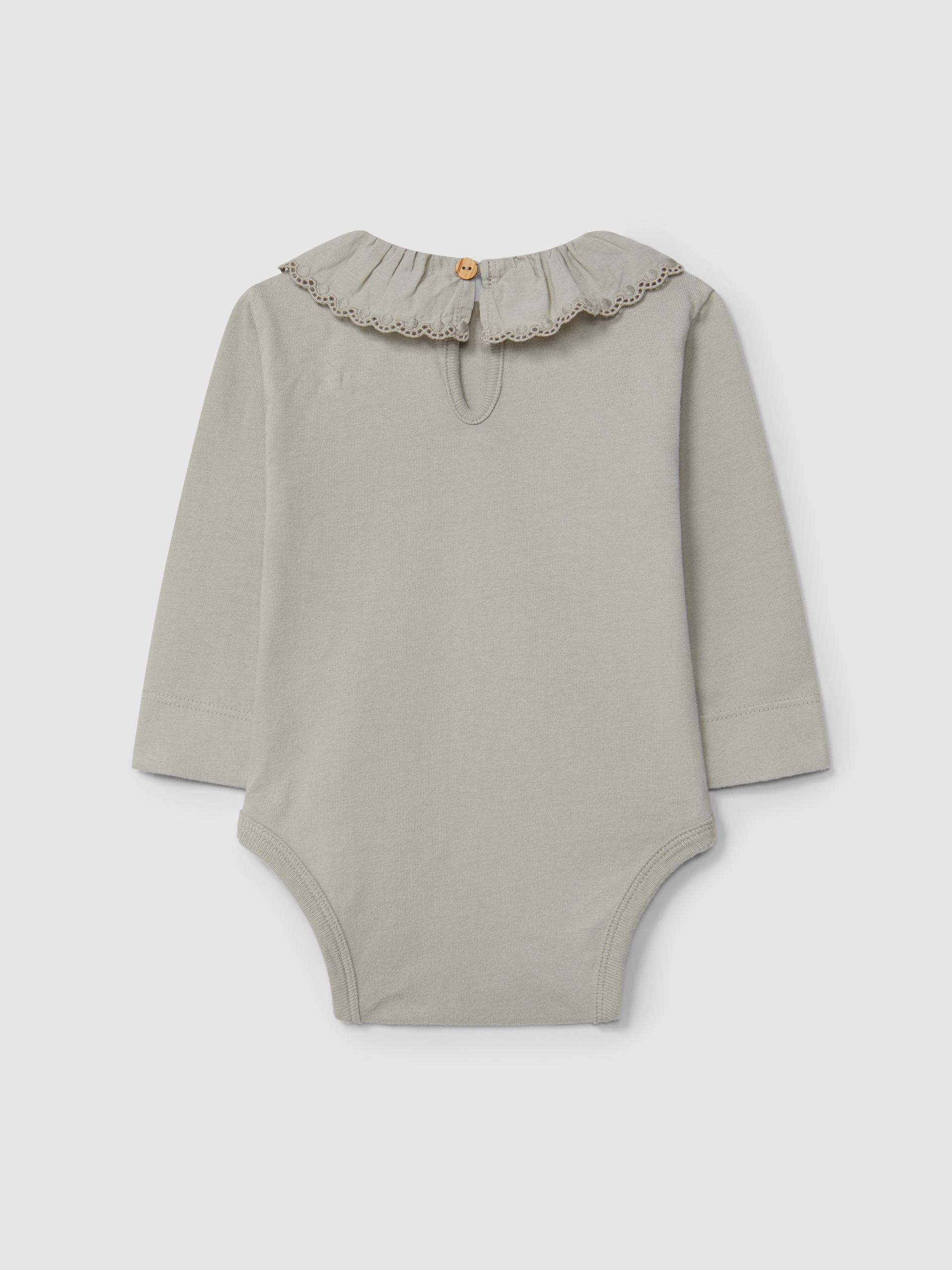 Bodysuit in organic cotton with ruffled embroidered collar
