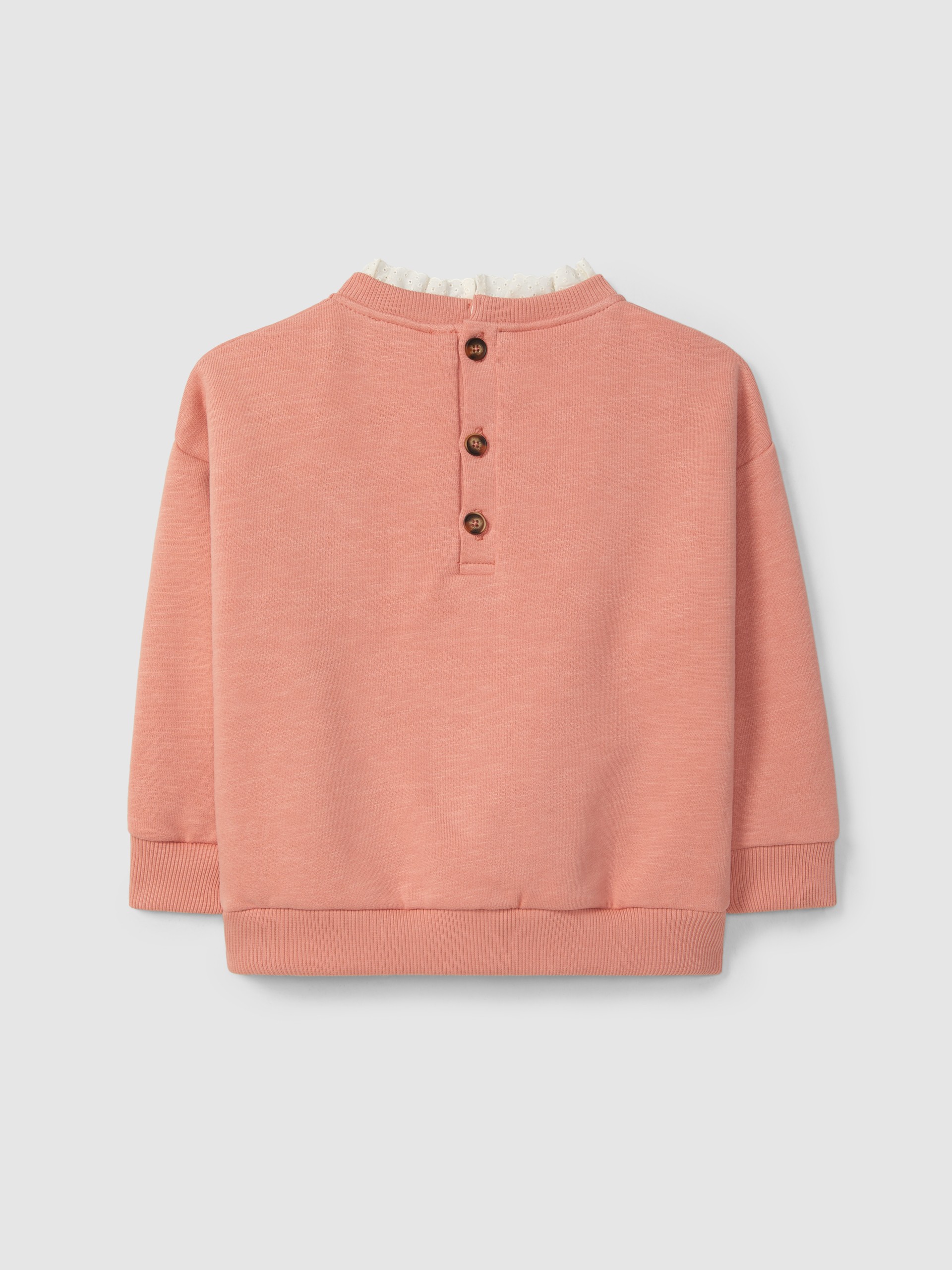 Sudadera flor y detalle de bordado inglés