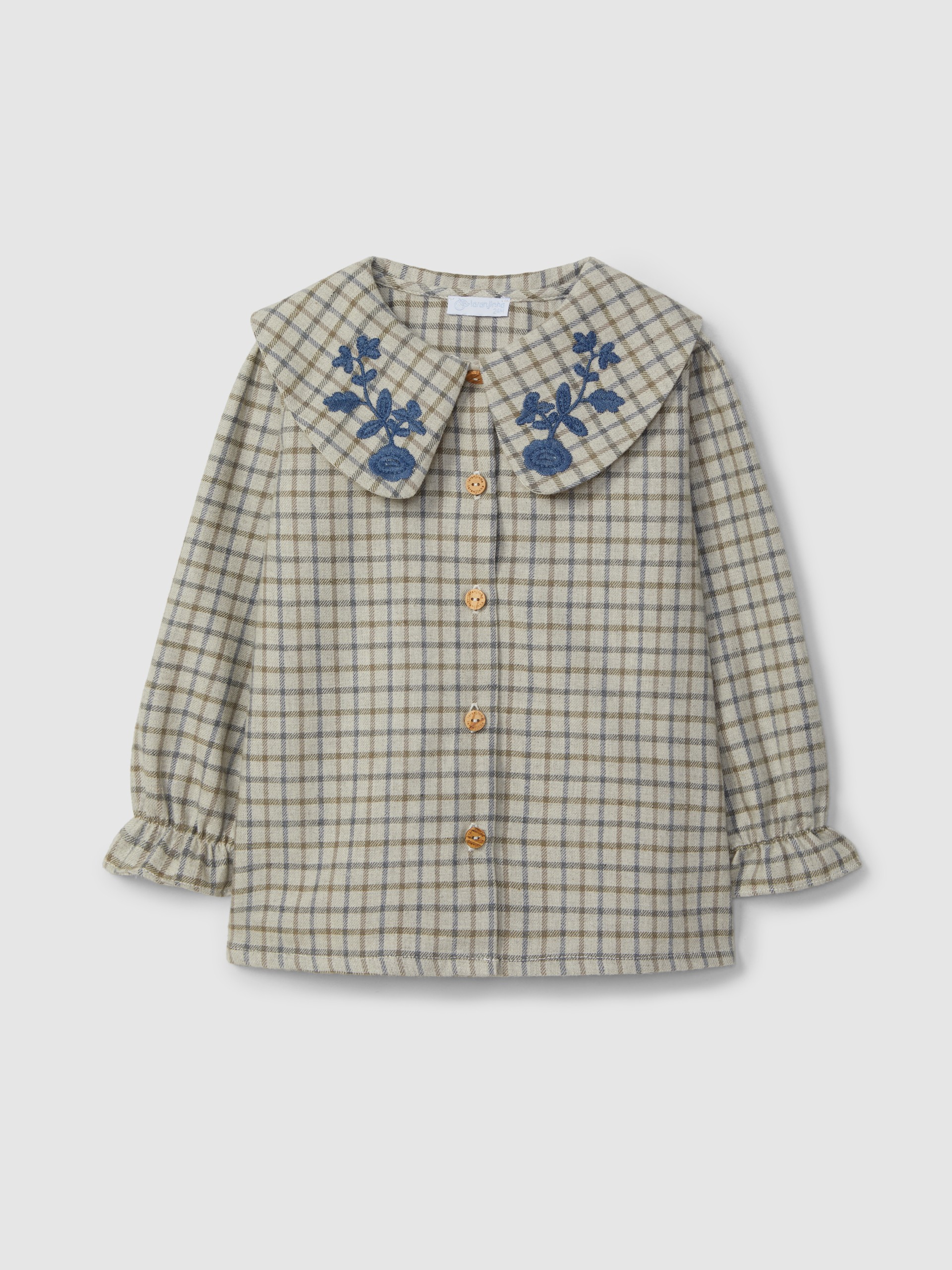 Blouse à carreaux avec broderie en fil de laine