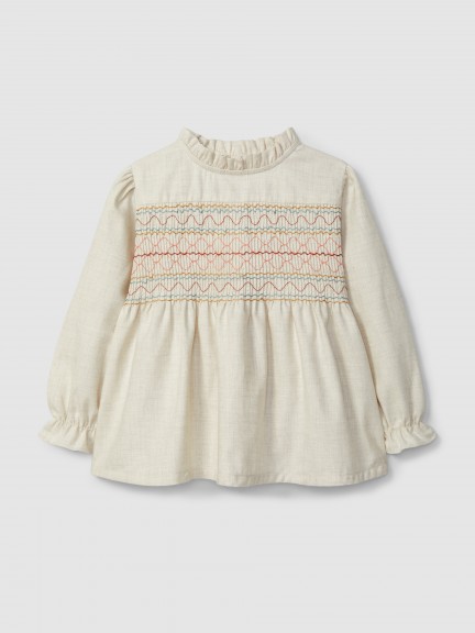 Blouse with smocking and ruffled details Blouse with smocking and ruffled details