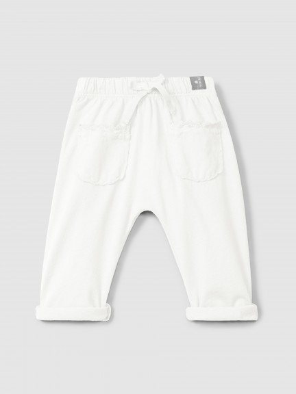 Plain jersey pull-up pants with embroidered details Plain jersey pull-up pants with embroidered details