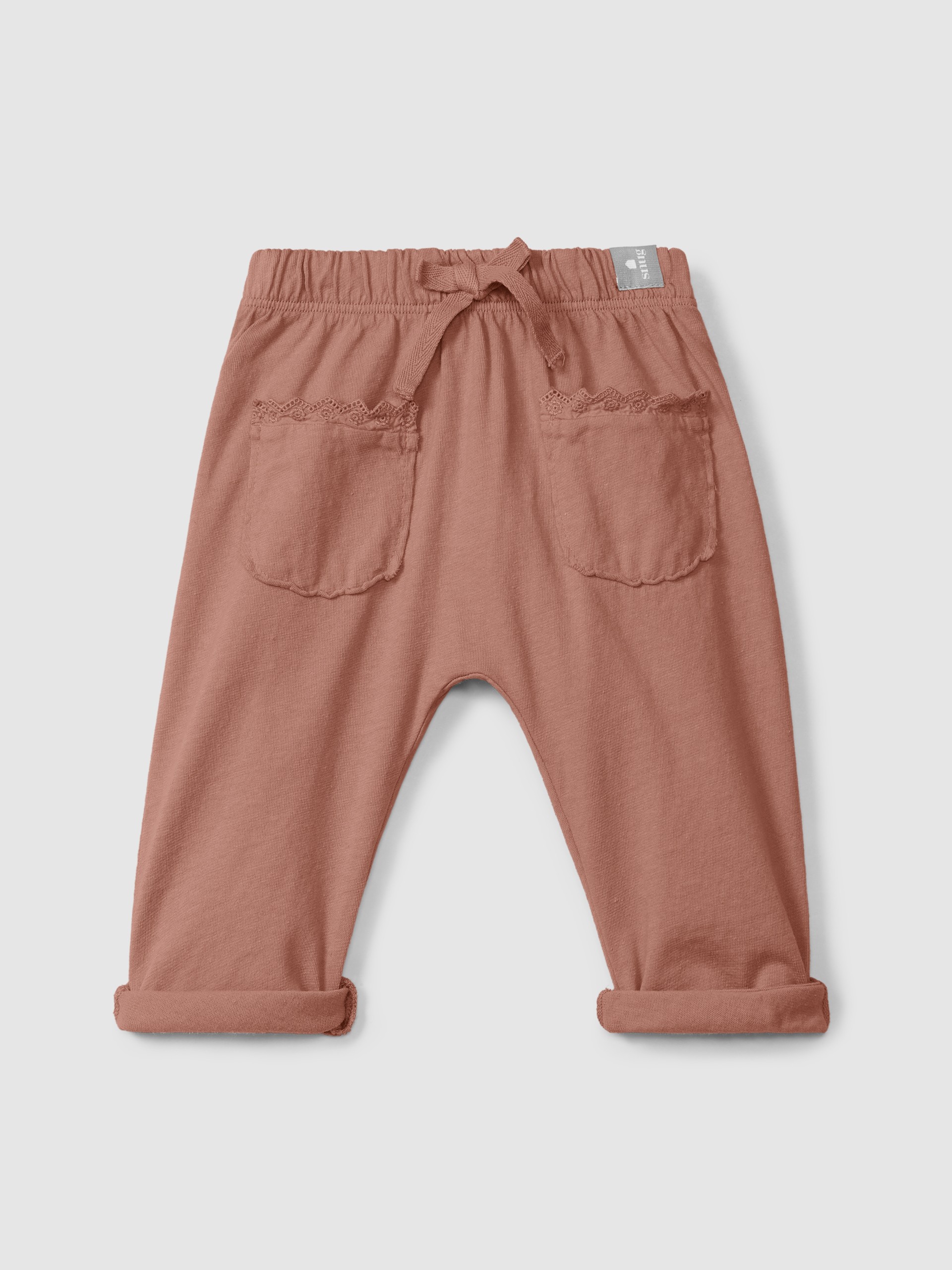 Pantalon pull-up en maille unie avec détails brodés
