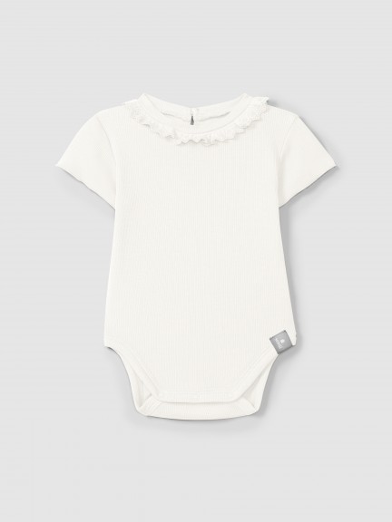 Bodysuit in ribbed jersey with English embroidery collar Bodysuit in ribbed jersey with English embroidery collar