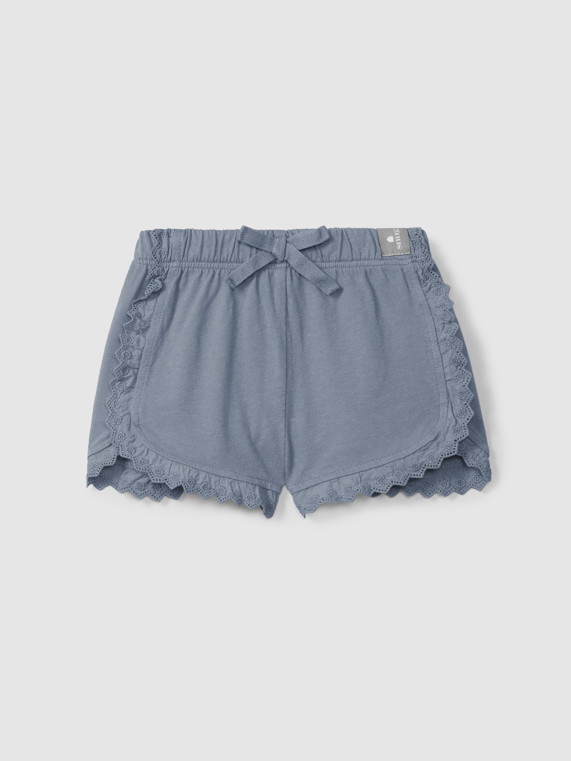 Pantalón corto en punto liso con detalles bordados