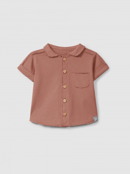 Polo en maille unie avec poche Polo en maille unie avec poche