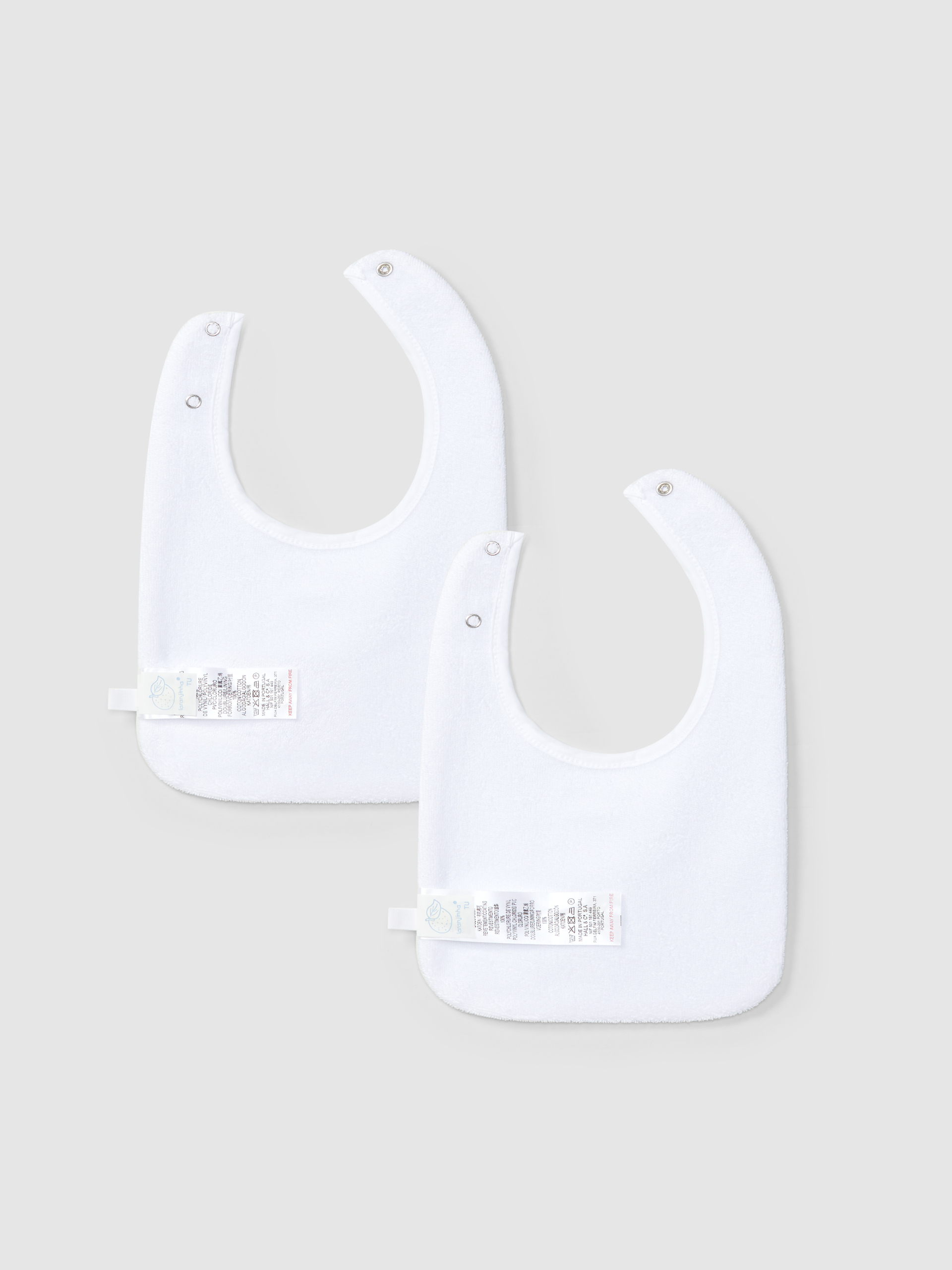 Lot de deux bavoirs brodés et maille avec effet ajouré