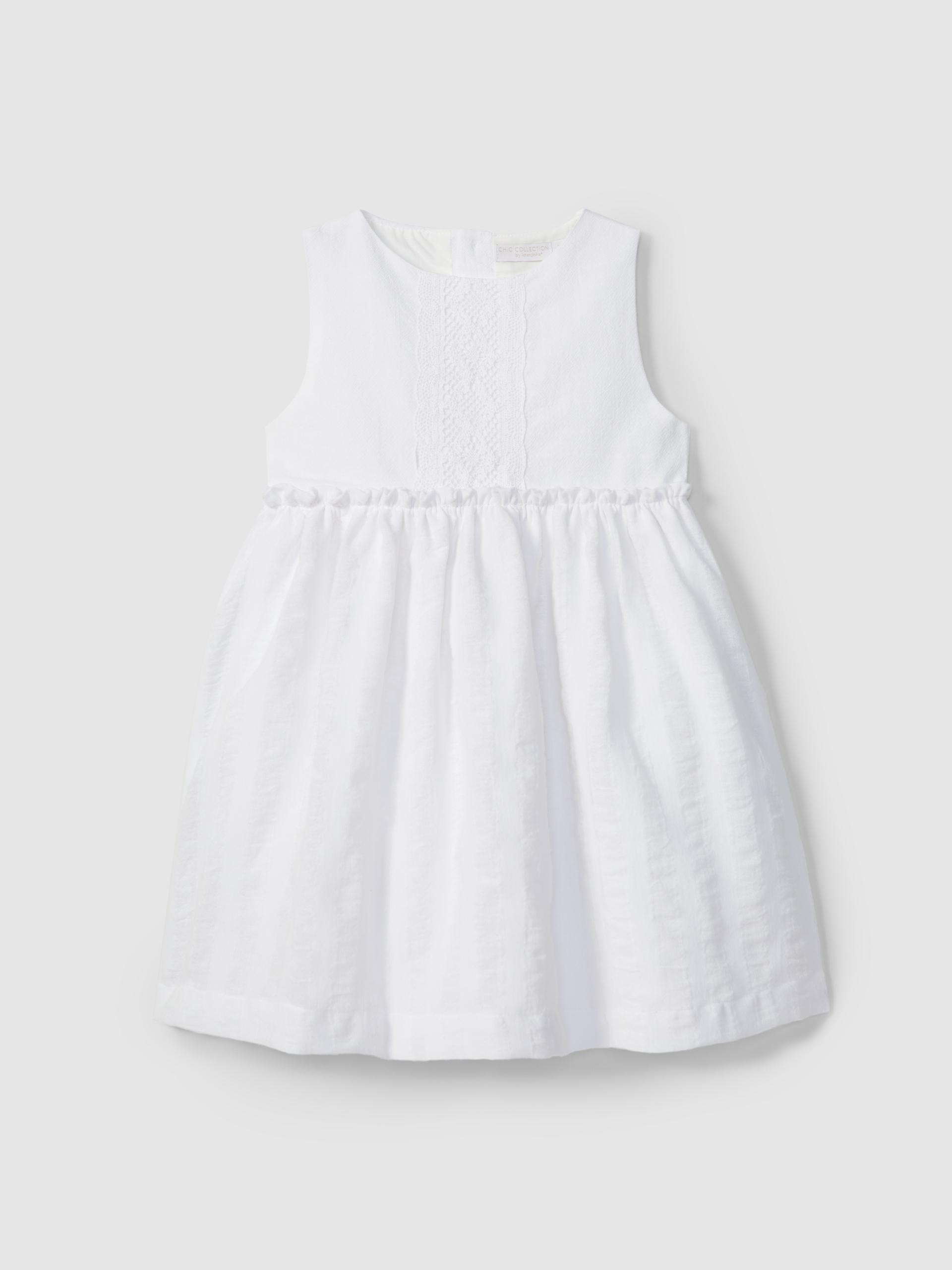 Vestido linho com aspecto natural e detalhe em croché