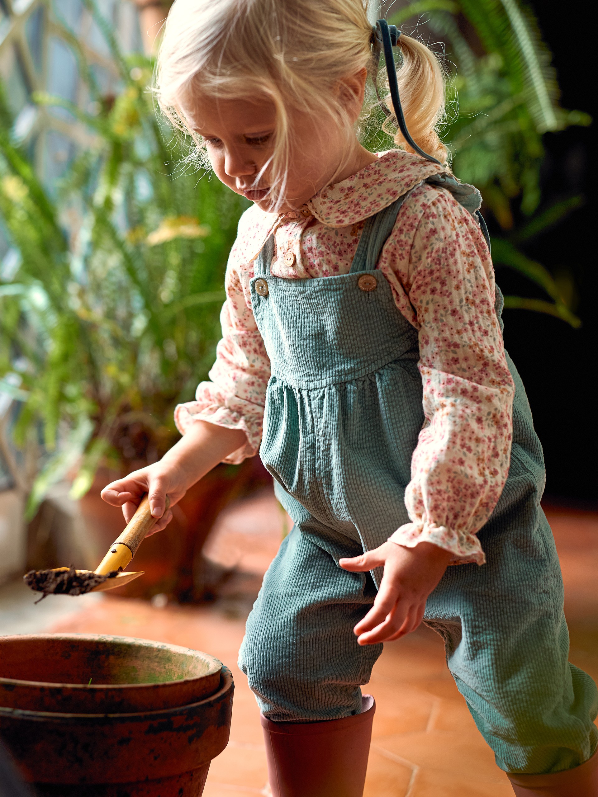 Corduroy dungarees with ruffled detail