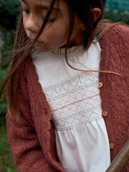 Blouse with smocking and ruffled details Blouse with smocking and ruffled details