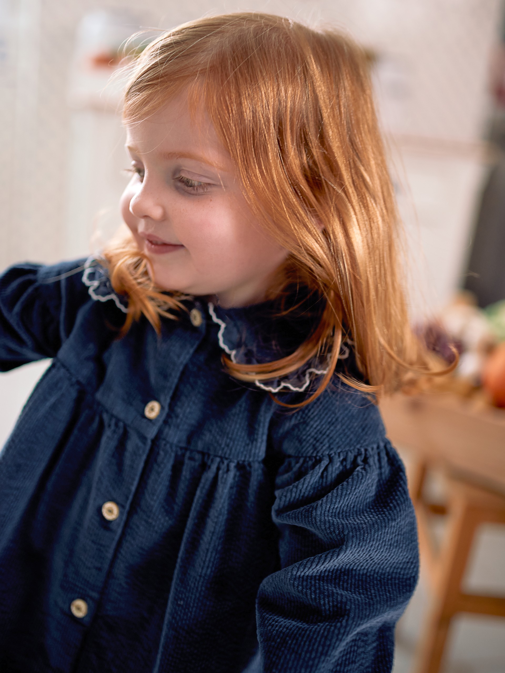 Corduroy dress with embroidered detail on the collar