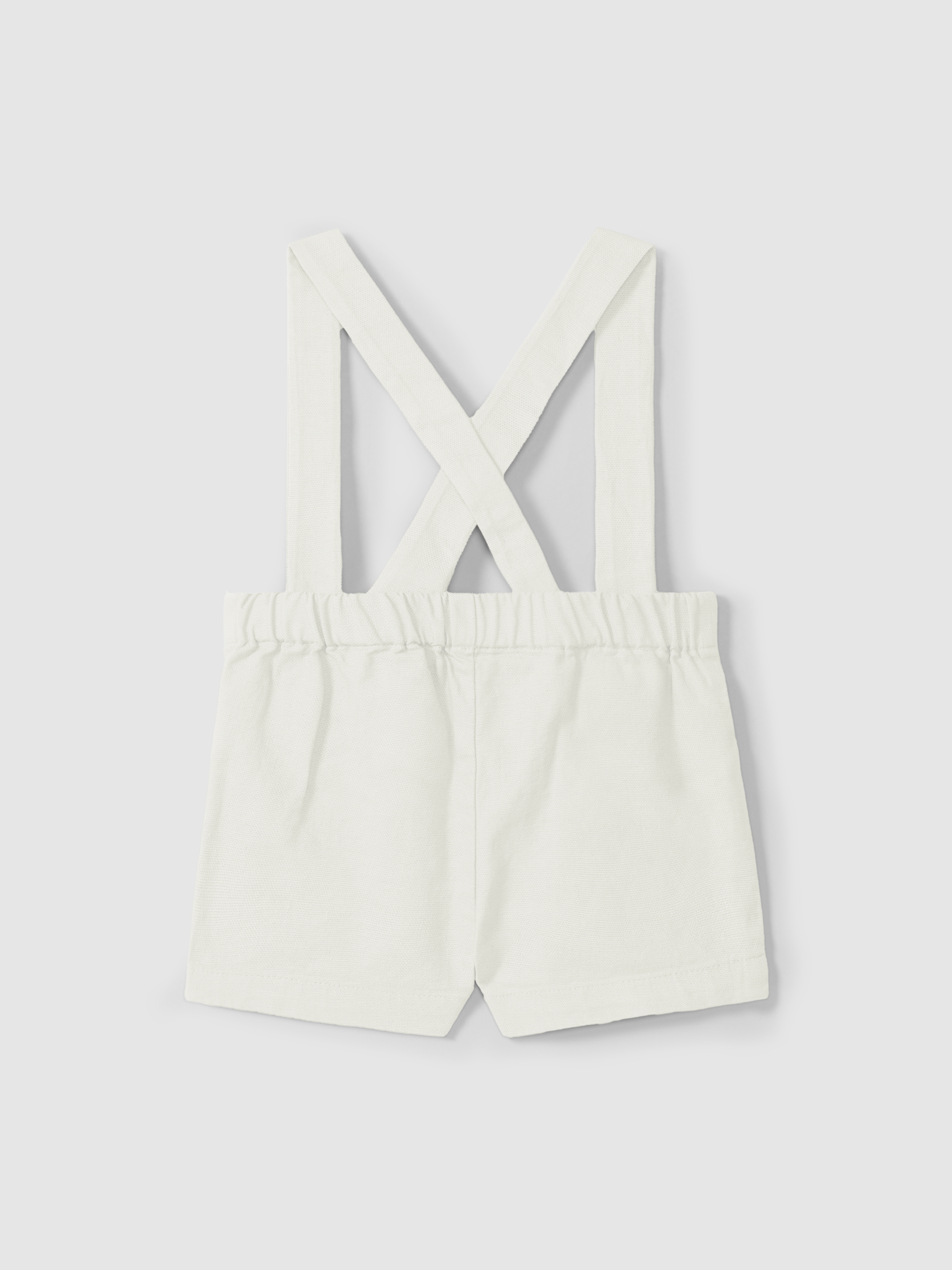 Short à bretelles en tissu uni