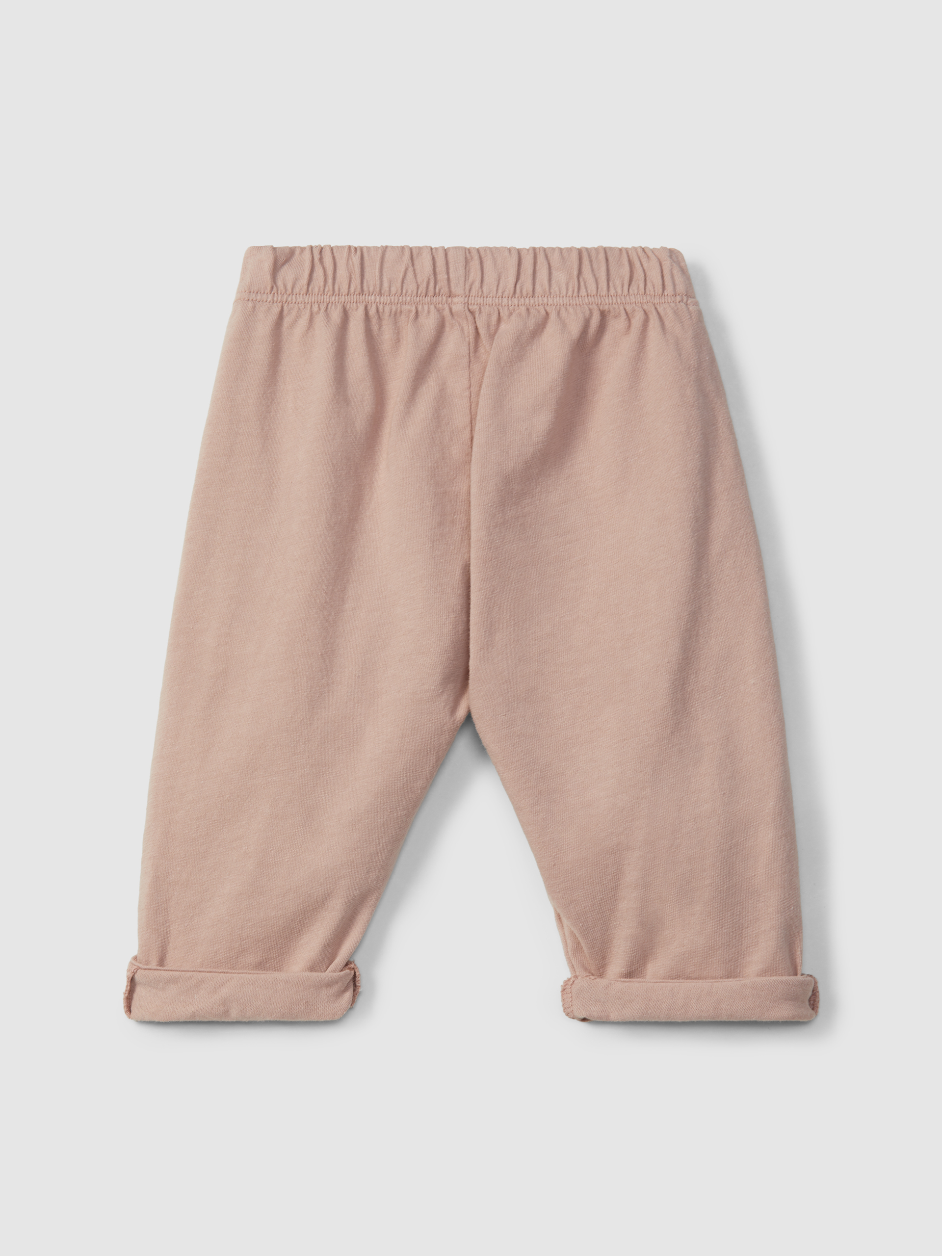 Calças pull-up em malha lisa com detalhes bordados