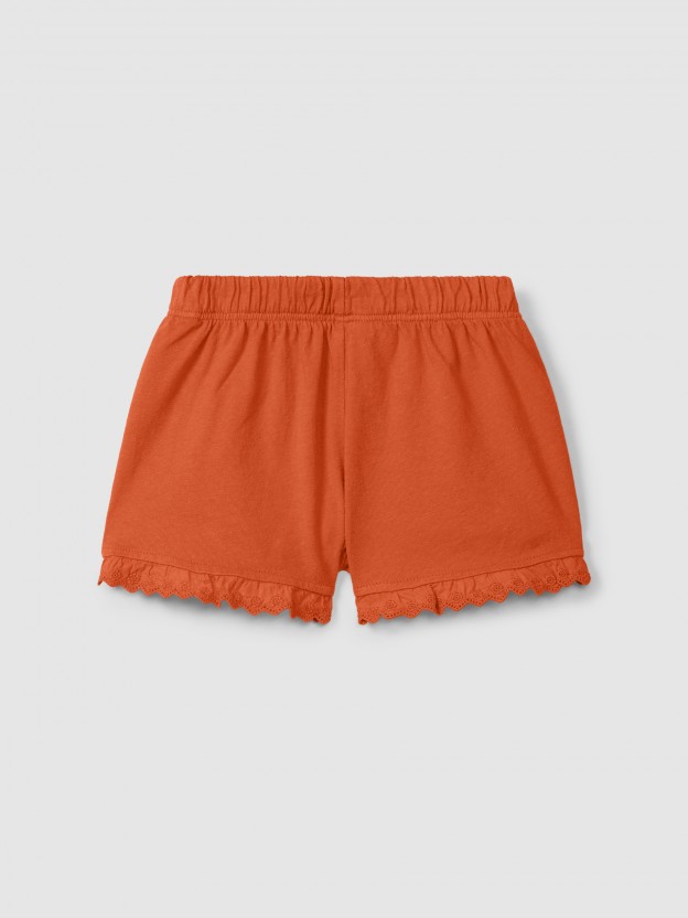 Cal��es pull-up em malha lisa com detalhes bordados