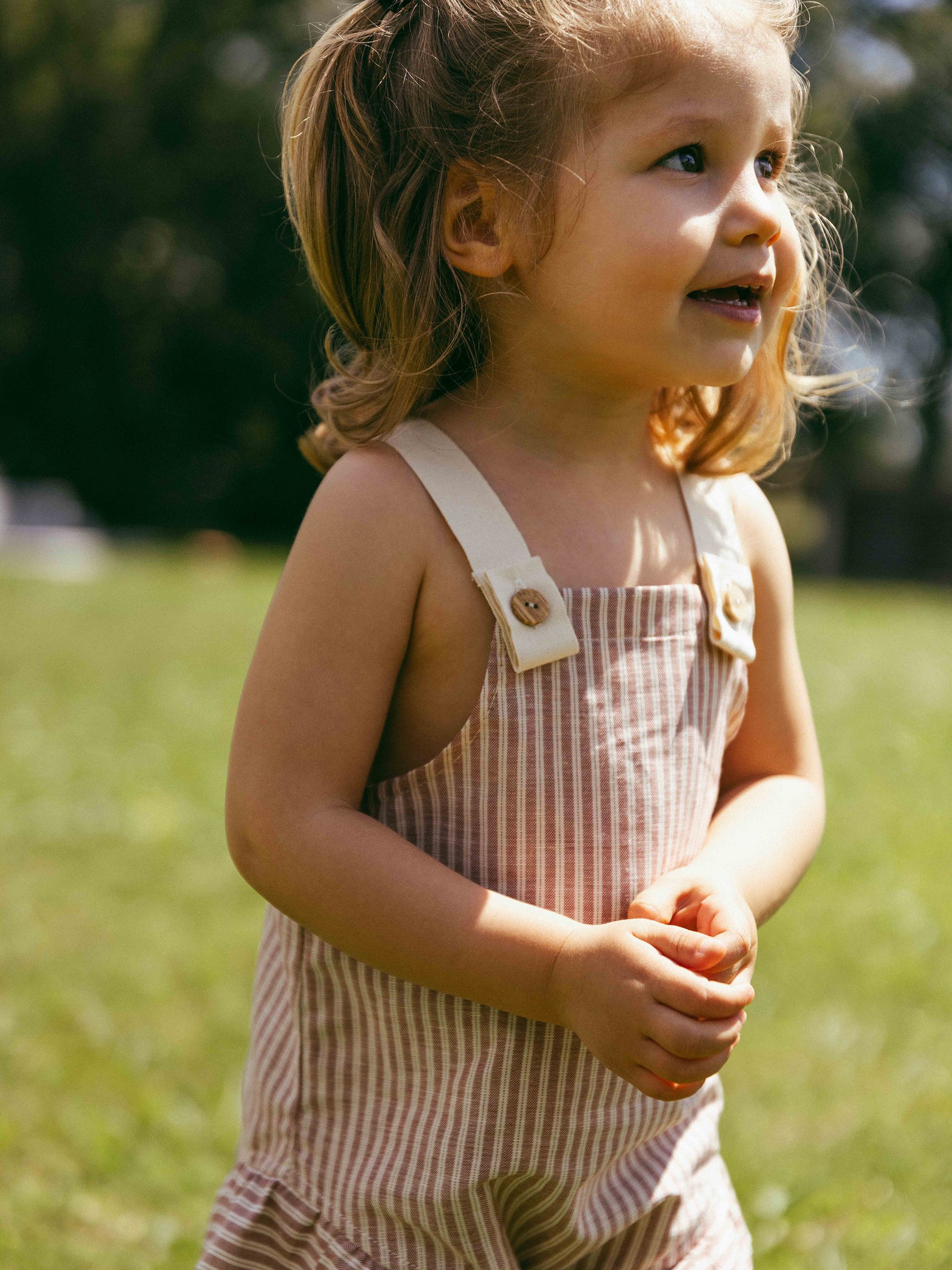 Overalls in striped fabric and English embroidery detail