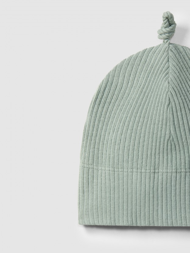 Bonnet avec nœud en maille cannelée Bonnet avec nœud en maille cannelée