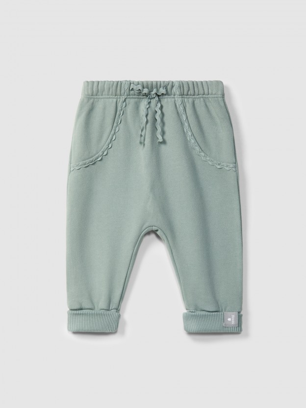 Pantalones pull-up en felpa con detalle en picunela Pantalones pull-up en felpa con detalle en picunela