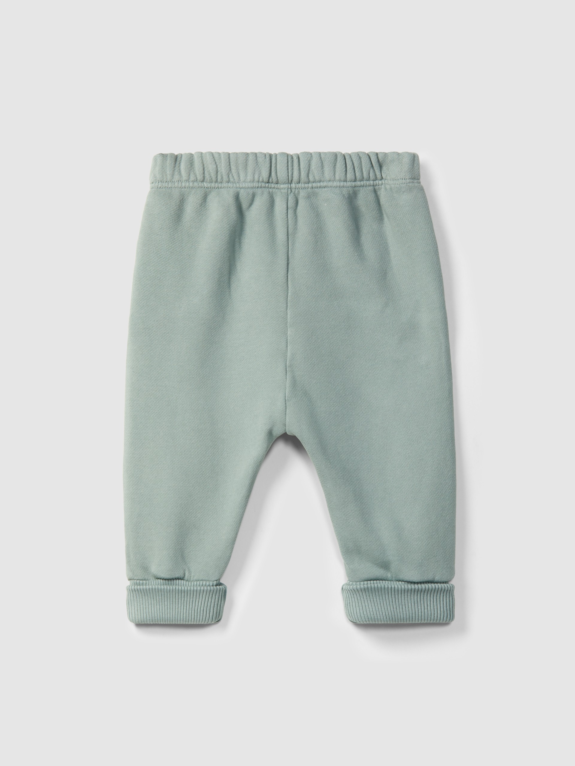 Pantalones pull-up en felpa con detalle en picunela