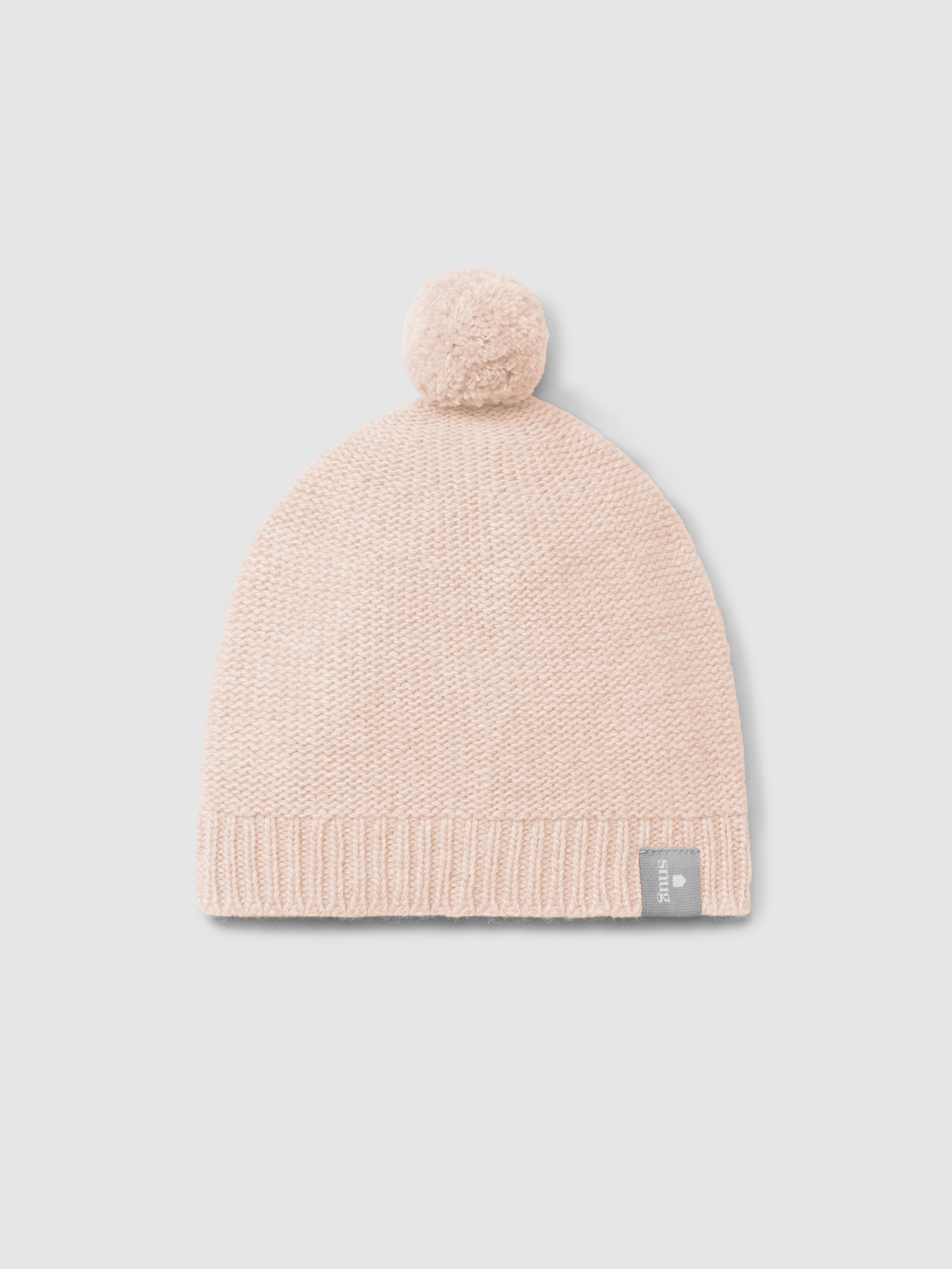 Bonnet tricoté avec pompon