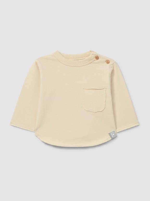 Camiseta de manga larga con bolsillo en algodón orgánico Camiseta de manga larga con bolsillo en algodón orgánico