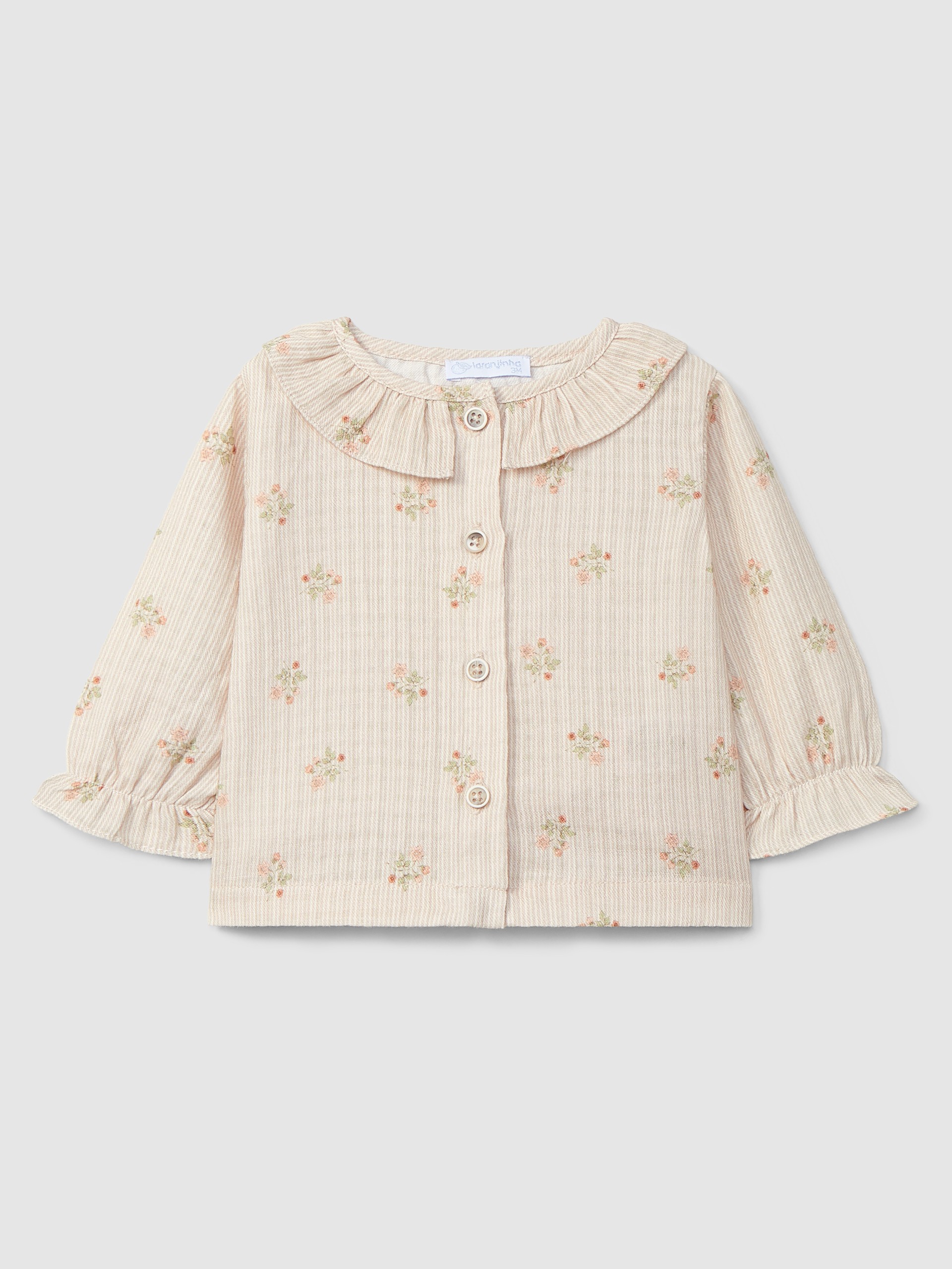 Blusa de flores con cuello de volante