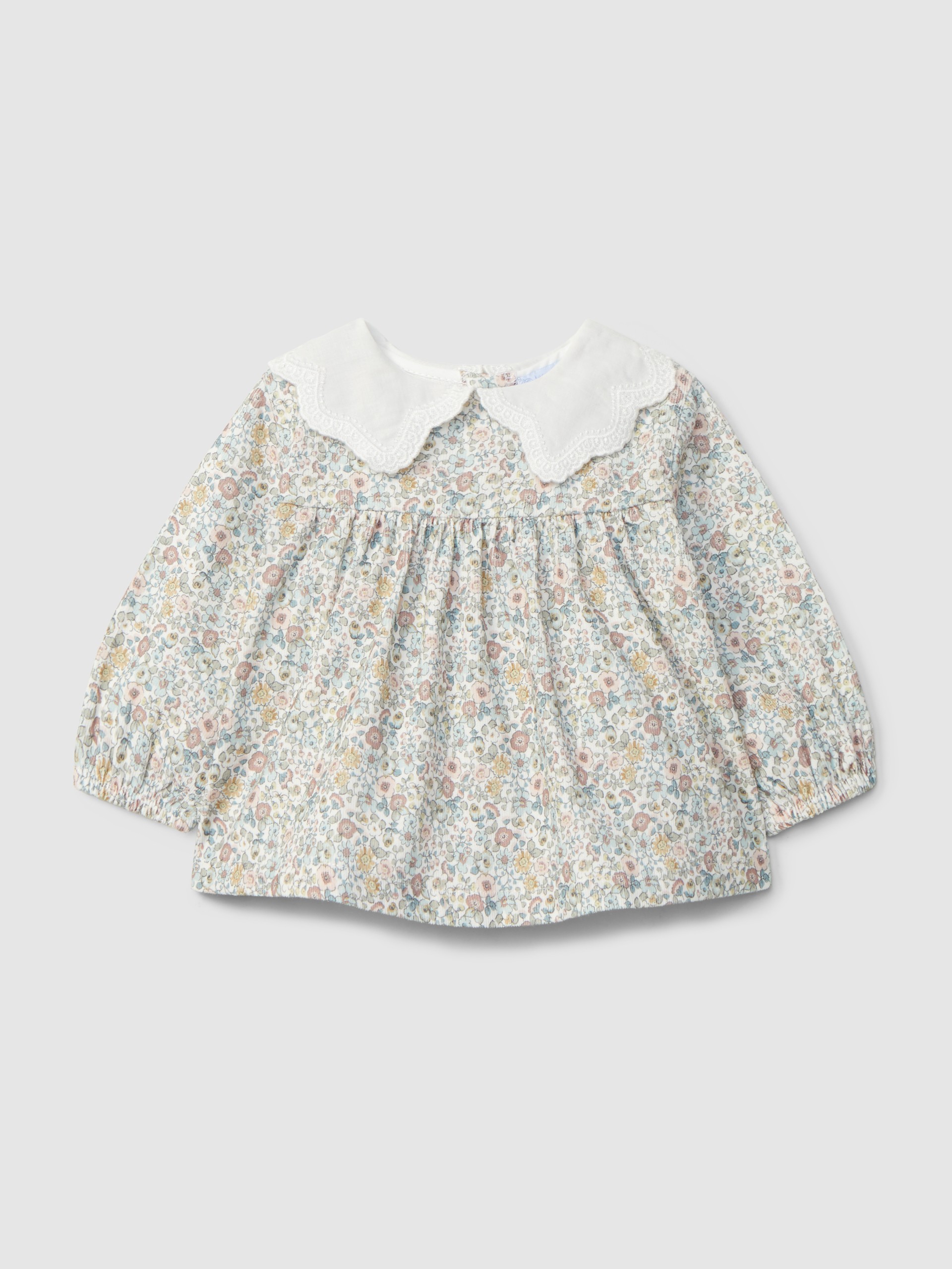 Blusa en pana floral con cuello bordado