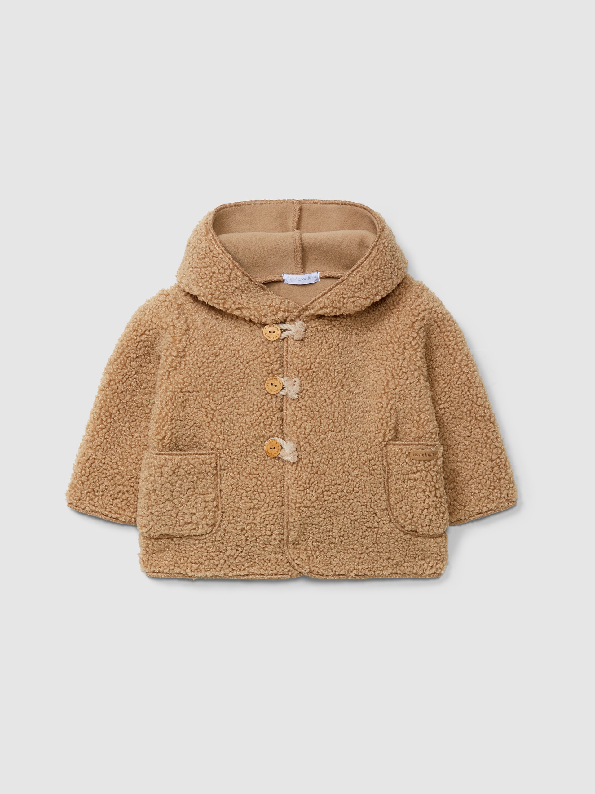 Gilet en fourrure à capuche