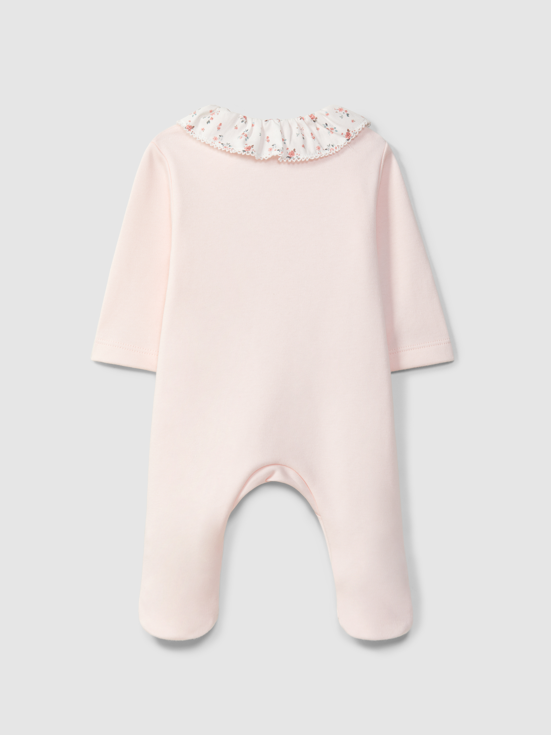 Mono de bebé con cuello de volante con flores
